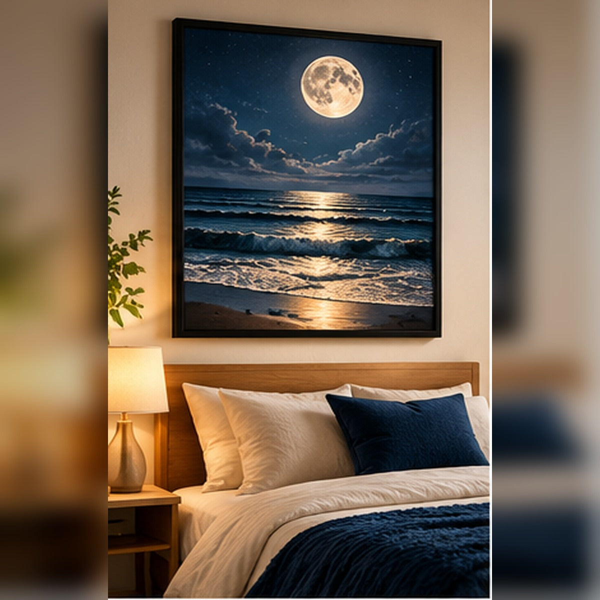 Moonlit ocean and waves in a black frame above a softly styled bedroom bed