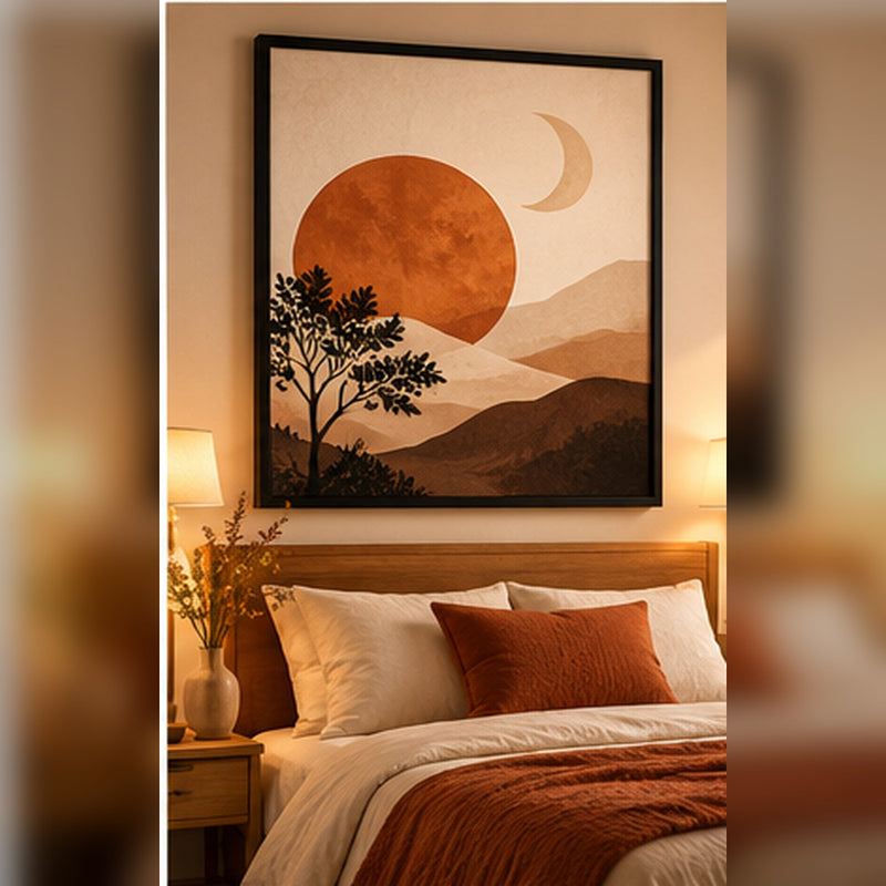 Terracotta sun and moon abstract landscape in a black frame above a bed